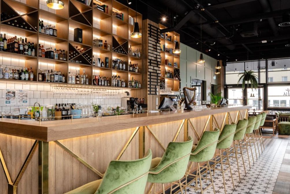 Refined lounge bar with warm ambient lighting and elegant seating